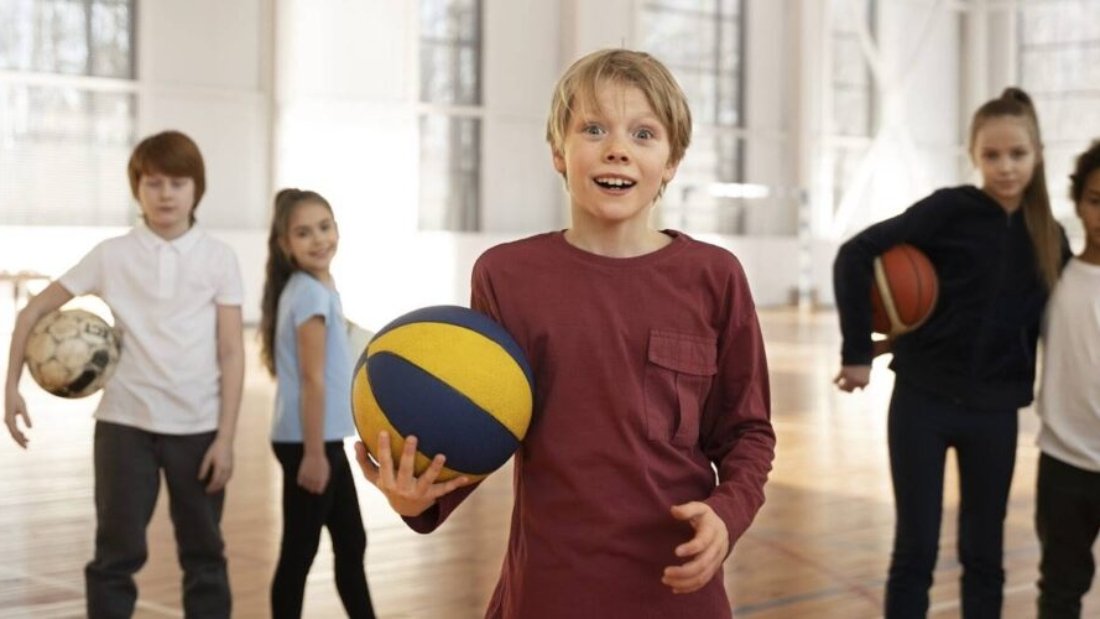 Kids stand with great enthusiasm and style, eagerly preparing to start playing volleyball showing best kids volleyball shoes