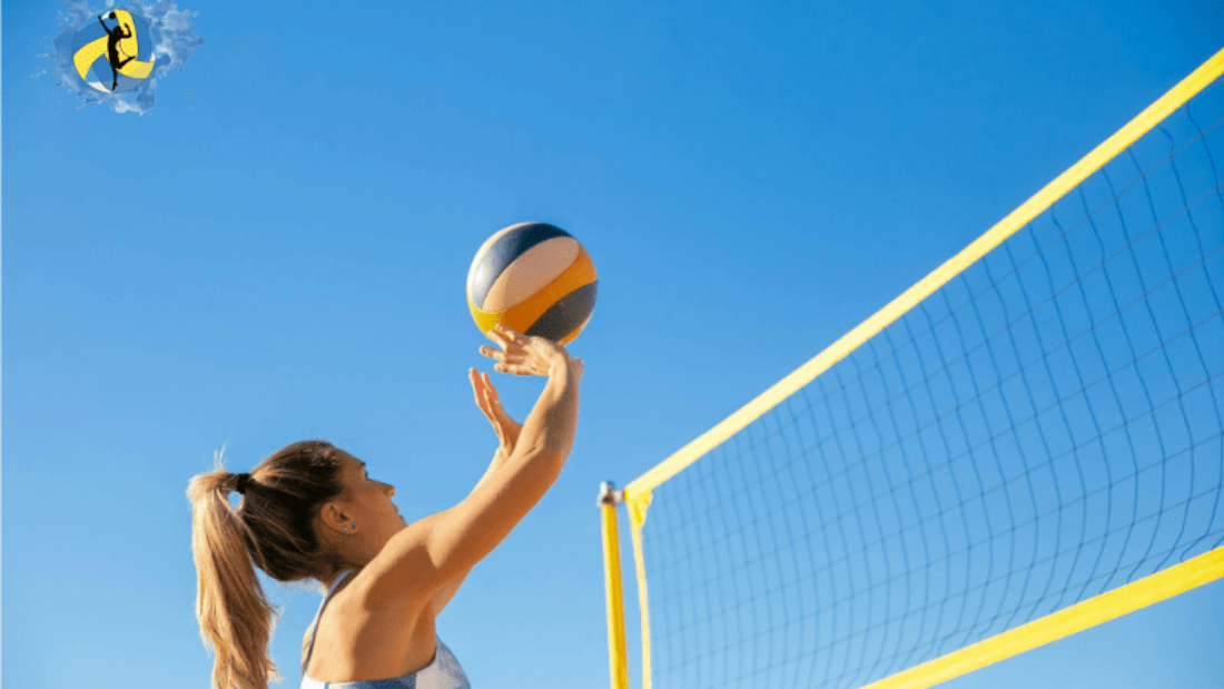 A women playing volleyball on outdoor court