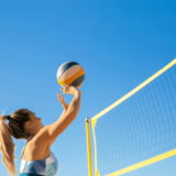 A women playing volleyball on outdoor court