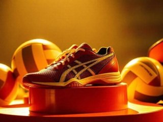 Yellow volleyball shoe showcasing the importance of a supportive midsole for enhanced performance of midsole volleyball shoes