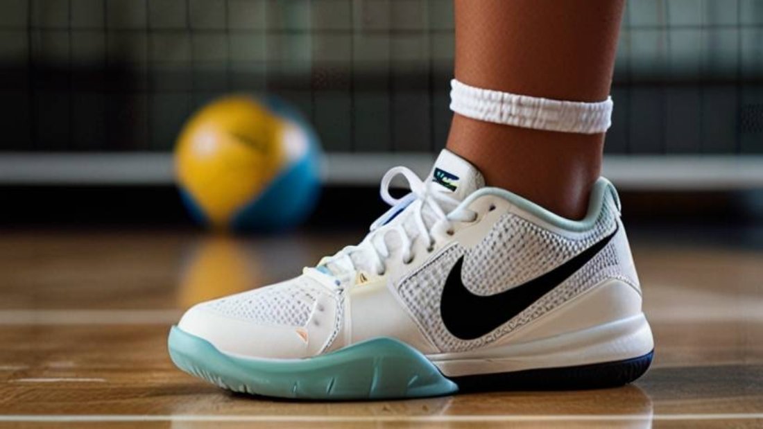 White Nike volleyball shoes with a volleyball in the background, highlighting the shoes' sleek design and court-ready performance.