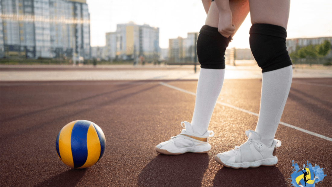 a girl in outdoor volleyball court with a volleyball in front of her wearing technology volleyball shoes