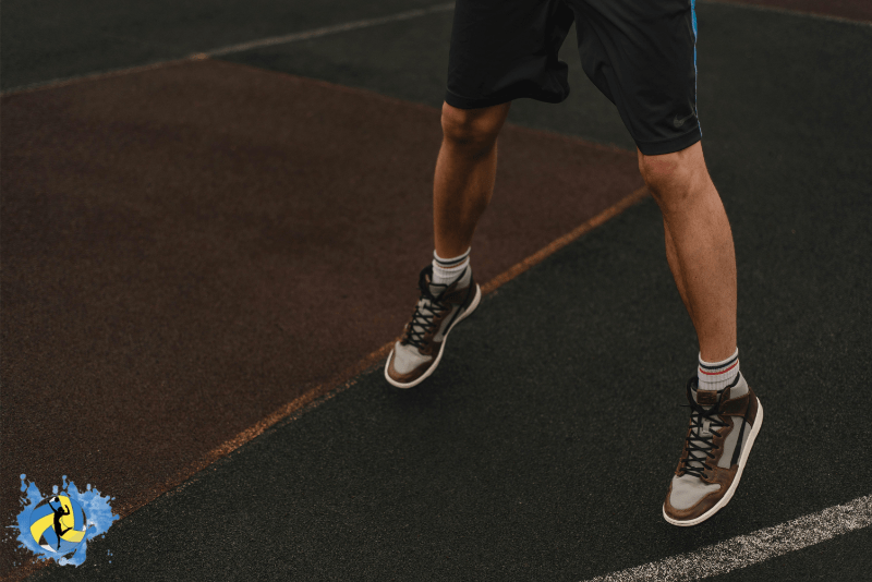 a man jumping in a basketball court wearing best sports shoes